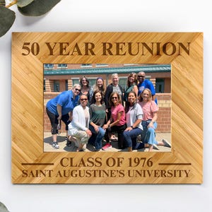 May include: A rectangular bamboo photo frame featuring laser-engraved text that reads 50 YEAR REUNION, CLASS OF 1976, and SAINT AUGUSTINE'S UNIVERSITY. The frame holds a photograph of a group of people standing in front of a brick building.