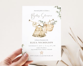May include: A baby shower invitation with a watercolor illustration of a baby dress, a bib, and a basket hanging on a clothesline. The text reads "Please join us for a Baby Shower in honor of mommy-to-be Eliza Nicholson Saturday July 17, 2024 at 3 PM Andrew Residence 1654 Gordon Street, Denver, Colorado RSVP to Sarah at 123-456-7890 by July 2nd"