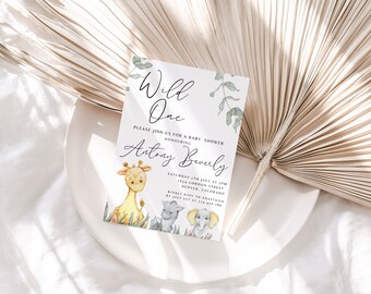 May include: A white baby shower invitation with green leaves and a watercolor illustration of a giraffe, elephant, and two other animals. The text reads "Wild One" and "Please join us for a baby shower honoring Artiny Beverly".