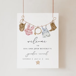 May include: A gender reveal party invitation with a rustic theme. The invitation features a clothesline with a cowboy hat, a pink dress, a horseshoe, overalls, and cowboy boots hanging from it. The text on the invitation reads "Welcome to Ava and Josh Beverly's gender reveal, Saturday | July 17 | 2023".