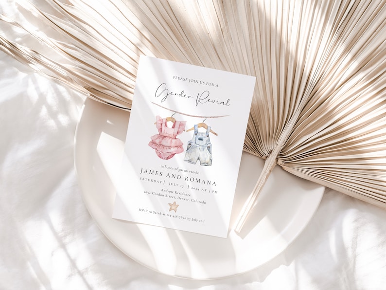 May include: A gender reveal invitation with a watercolor illustration of a pink and blue baby outfit hanging on a clothesline. The invitation reads "Please join us for a Gender Reveal" in honor of parents-to-be James and Romana. The event is scheduled for Saturday, July 1st, 2023 at 3 PM at 1694 Garden Roses, Denver, Colorado. RSVP to [email protected] by July 1st.