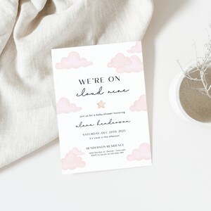 May include: A baby shower invitation featuring a pink and white cloud design. The text reads "We're on cloud nine" and includes the date and time of the event. The invitation is for a baby shower honouring Alane Henderson.