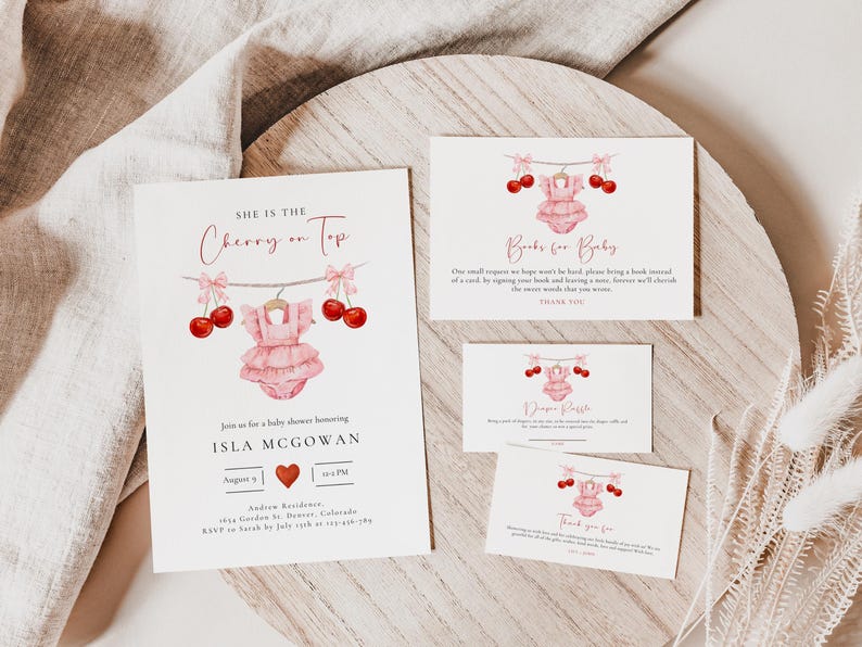 Puede incluir: Invitaci&oacute;n a un baby shower rosa y rojo con un tema de cereza. La invitaci&oacute;n dice "Ella es la cereza del pastel" y presenta un mameluco rosa para beb&eacute; con cerezas colgando de una cuerda. La invitaci&oacute;n tambi&eacute;n incluye el nombre del beb&eacute;, Isla McGowan, y la fecha y hora del baby shower.
