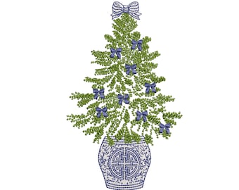 May include: A green Christmas tree with blue bows is in a blue and white ceramic pot. The tree is decorated with blue bows.