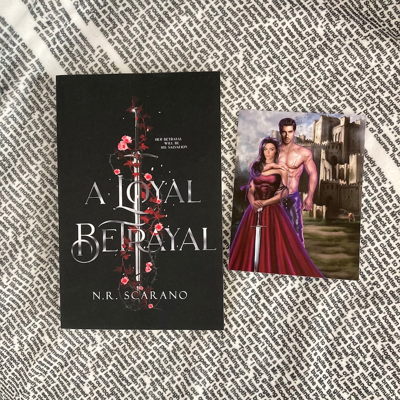 May include: A black and silver book cover with the title "A Loyal Betrayal" and the author's name "N.R. Scarano". The cover features a sword with red roses wrapped around it. The book cover is next to a smaller image of a couple in front of a castle.
