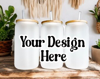 May include: Three frosted glass tumblers with wooden lids and straws. The tumblers are blank and ready to be customized with a design. The text "Your Design Here" is printed on a sticker in front of the tumblers.