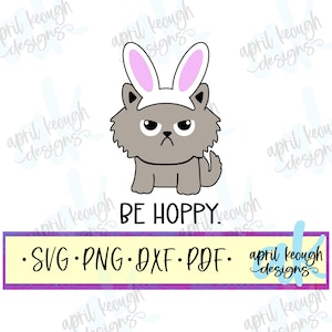 May include: A gray cat wearing bunny ears with the text "BE HOPPY" below. The image includes the text "SVG PNG DXF PDF" in a yellow and purple banner.