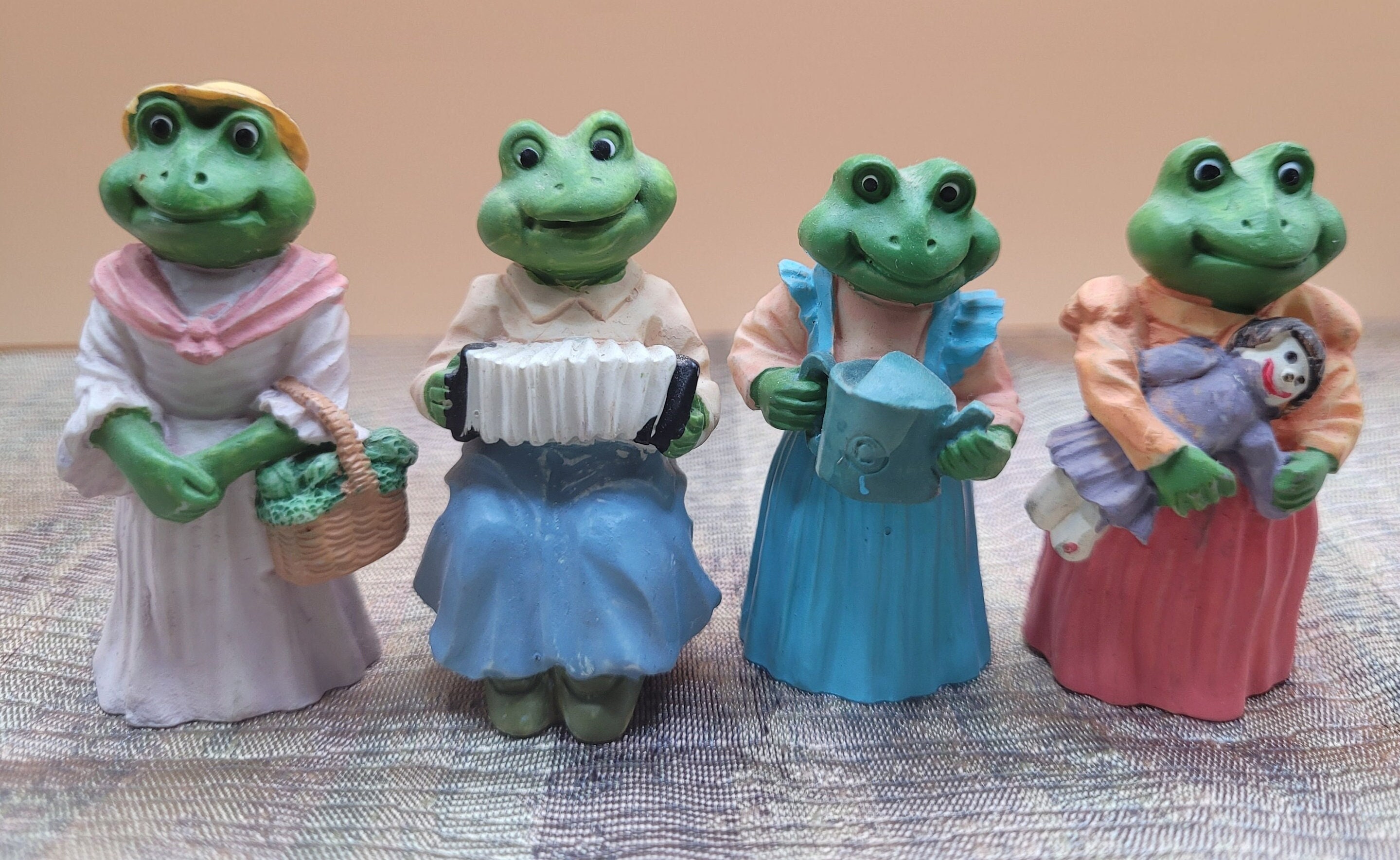 Set of Four Vintage Anthropomorphic Frogs - 1991 J.C. Country Girl Brand - Miniature Clothed Frog Figurines Holding Accordion, Doll, Veggies