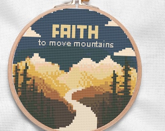 May include: A round, wooden-framed embroidery hoop with a cross-stitch design of a mountain range with the text "FAITH to move mountains". The mountains are yellow and orange, and the sky is blue with white clouds.