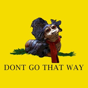May include: A yellow flag with a cartoon creature on it. The creature is blue and gray with a red scarf. The text "DONT GO THAT WAY" is printed in black at the bottom of the flag.