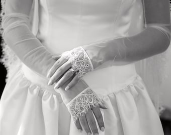 May include: A white wedding dress with a scoop neckline, sleeveless design, and a full skirt. The dress features a lace-trimmed veil and matching lace gloves. The image includes a customer review with five stars and the text "Beautiful!! Perfect!! Just what I was looking for!"