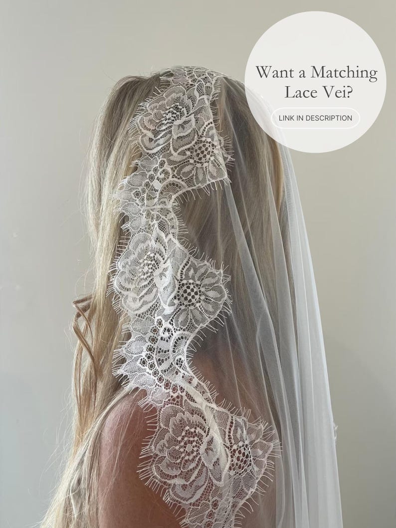 May include: A white lace veil with floral detailing. The veil is draped over the head and shoulders. The text on the image says, "Want a Matching Lace Veil?" and "LINK IN DESCRIPTION".
