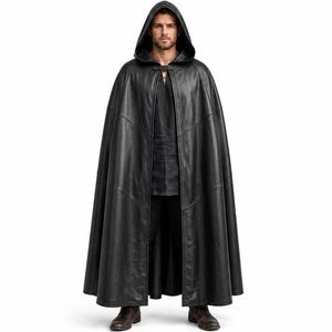 May include: A floor-length black hooded cloak featuring a smooth finish and a structured hood. The garment is secured at the neck with a single clasp and is constructed with visible vertical and horizontal seam lines throughout the fabric.