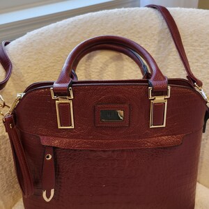 Bolso tipo cartera Mónaco y ribete dorado y burdeos intenso