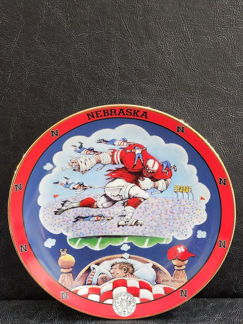 A Pair of Nebraska Porcelain Fan Plates by Gary Patterson and Danbury