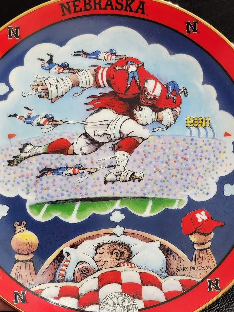 A Pair of Nebraska Porcelain Fan Plates by Gary Patterson and Danbury