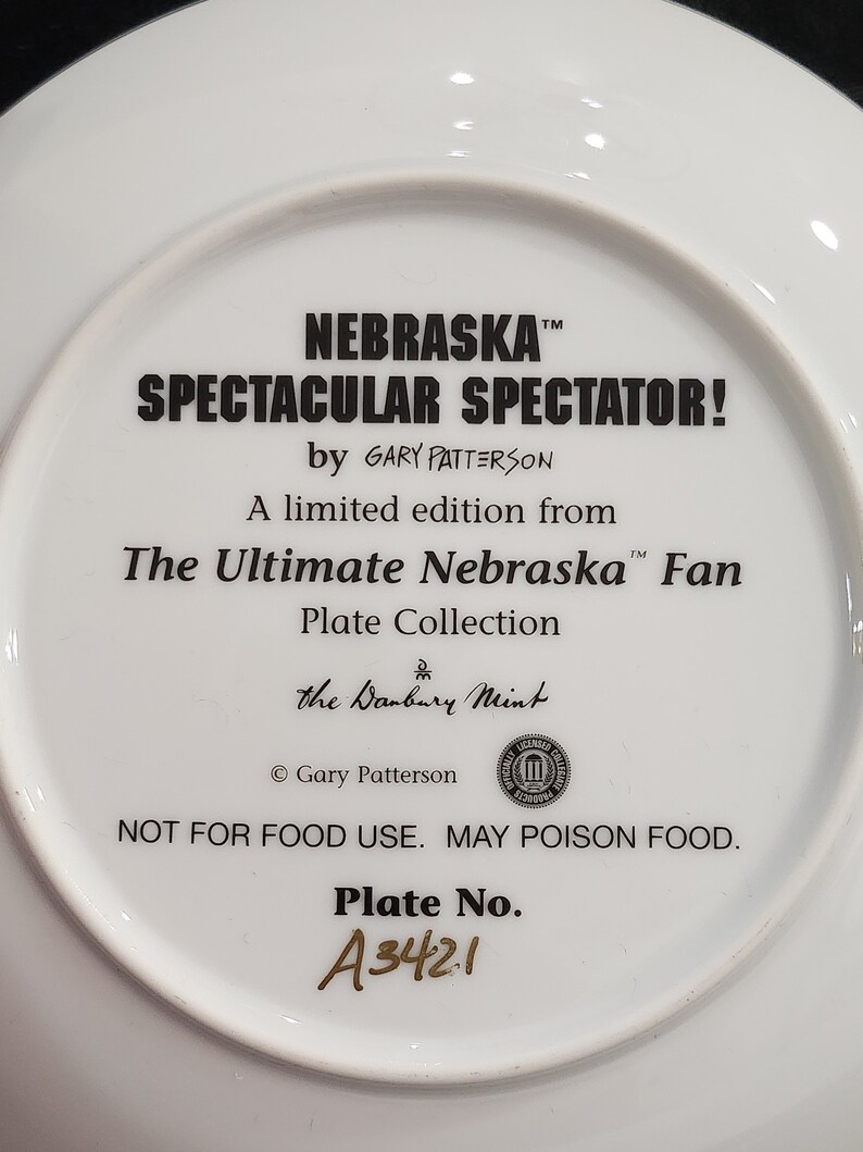 A Pair of Nebraska Porcelain Fan Plates by Gary Patterson and Danbury