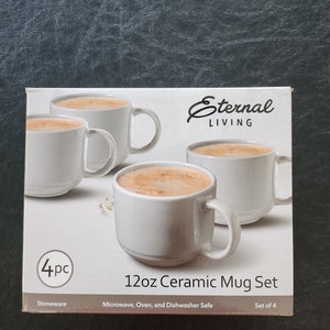 May include: A box of four white 12-ounce ceramic mugs with a black and white label that reads "Eternal Living 12oz Ceramic Mug Set". The label also says "Stoneware, Microwave, Oven, and Dishwasher Safe, Set of 4".