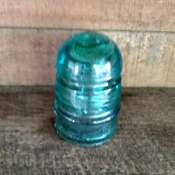 Aqua Blue Glass Star Railroad Telegraph Insulator with Bubbles in Glass