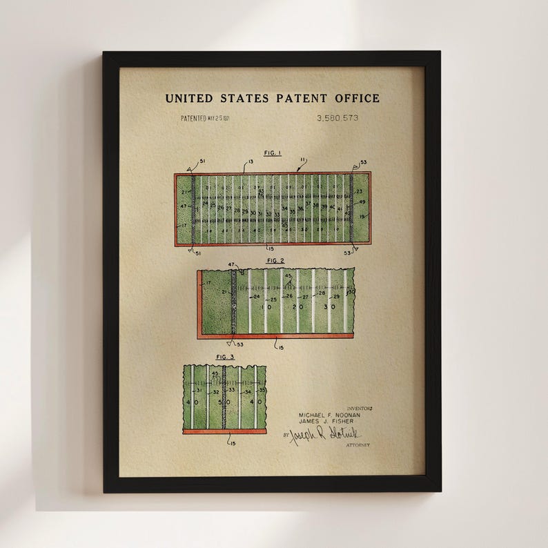 The image is a framed print of a United States patent office patent filing, featuring a detailed illustration of a football field with various markings and dimensions.