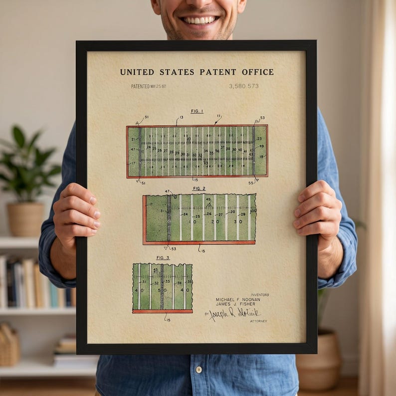 The image is a framed print of a United States patent office patent filing, featuring a detailed illustration of a football field with various markings and dimensions.
