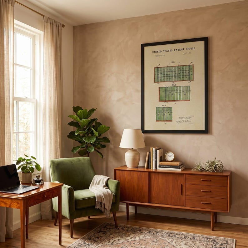 The image is a framed print of a United States patent office patent filing, featuring a detailed illustration of a football field with various markings and dimensions.