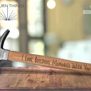 May include: A wooden handled hammer with a metal head. The handle is engraved with the text "I love building memories with you".