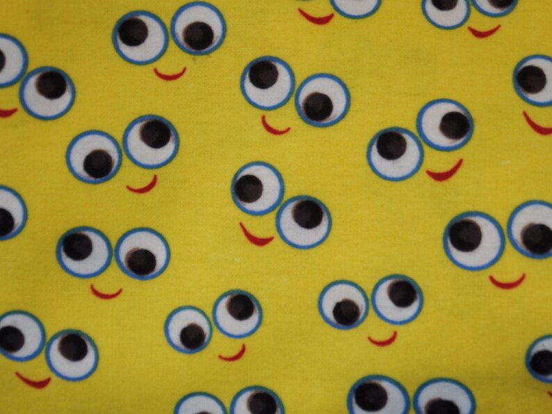 Large Googly Eyes Smiley Faces on a Yellow Background Flannel Fabric