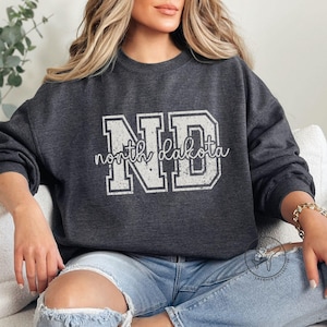 North Dakota Sweatshirt, North Dakota Varsity Shirt, Dakota ND Crewneck, Vintage Distressed Graphic, Travel Gift, Unisex Sweatshirt