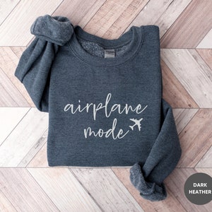 May include: Dark heather grey sweatshirt with the text "airplane mode" and a small airplane graphic.