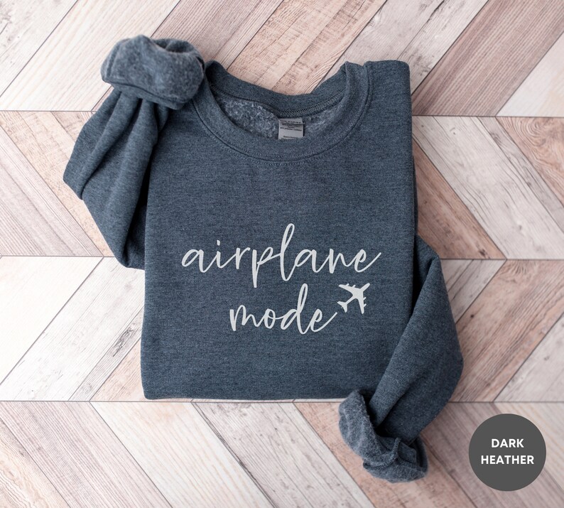 May include: Dark heather grey sweatshirt with the text "airplane mode" and a small airplane graphic.