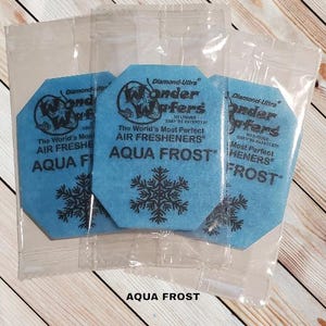 May include: Three blue air freshener wafers with a snowflake design and the text "Diamond-Ultra Wonder Wafers" and "Aqua Frost".