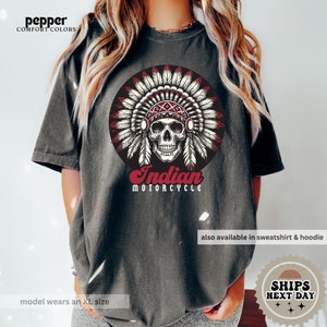 a woman wearing an indian headdress t - shirt