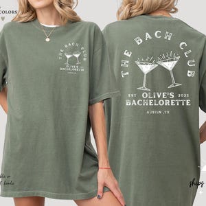 a woman wearing a green t - shirt with a martini on it