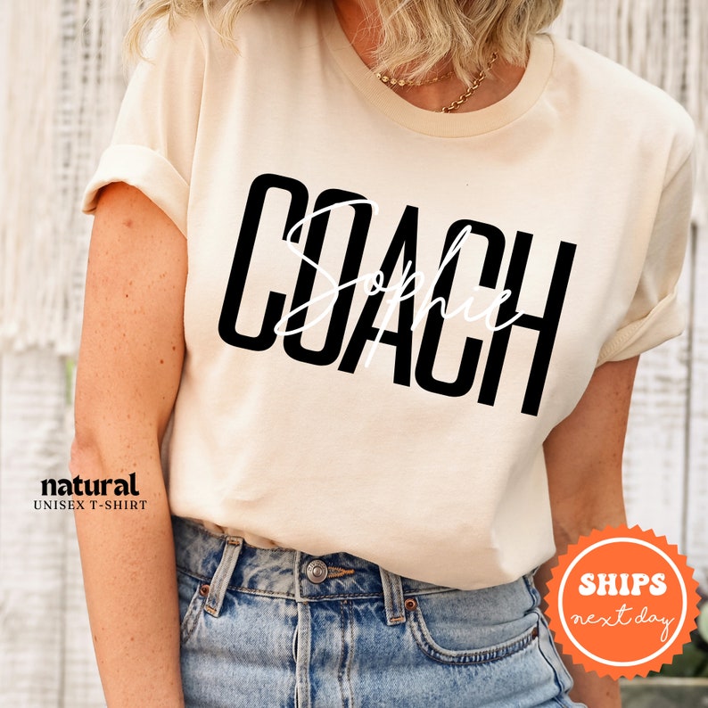 a woman wearing a t - shirt that says coach