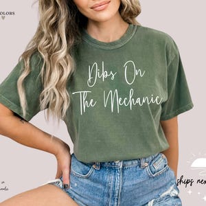 May include: A green t-shirt with the text "Dips On The Mechanic" in white lettering.