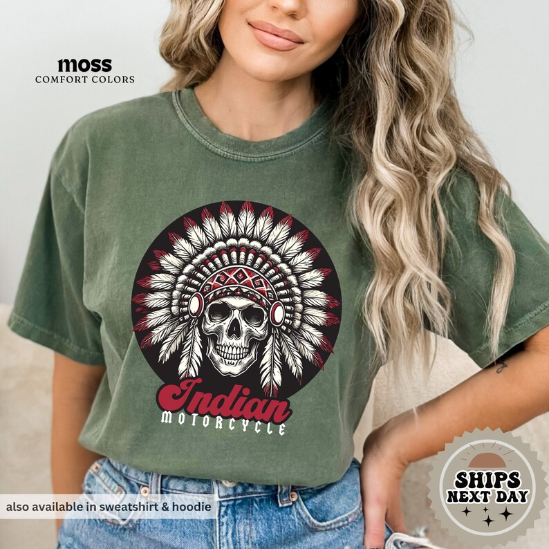 a woman wearing a green indian motorcycle t - shirt