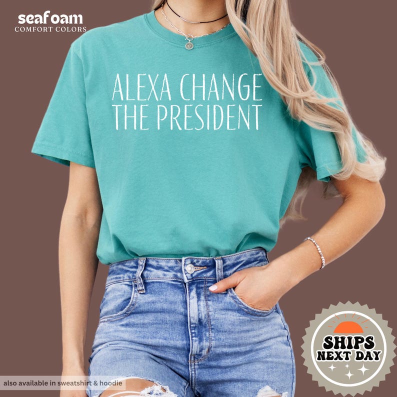 a woman wearing a t - shirt that says, alex change the president