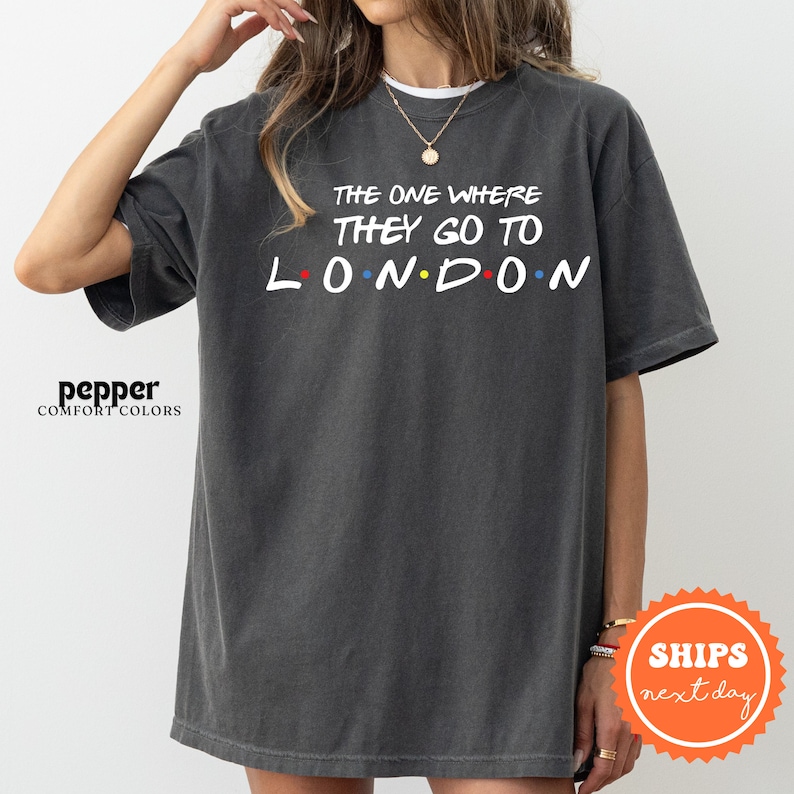 a woman wearing a black t - shirt that says the one where they go to