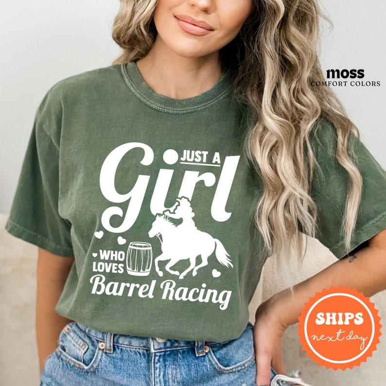 a woman wearing a t - shirt that says just a girl who loves barrel racing