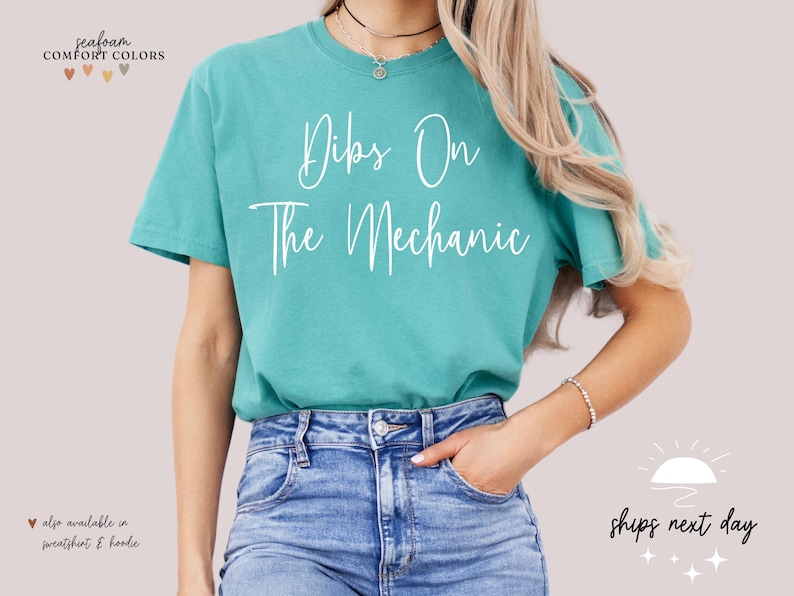 May include: A turquoise blue t-shirt with the text "Dips On The Mechanic" in white lettering.