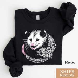 a black shirt with a picture of a possle on it