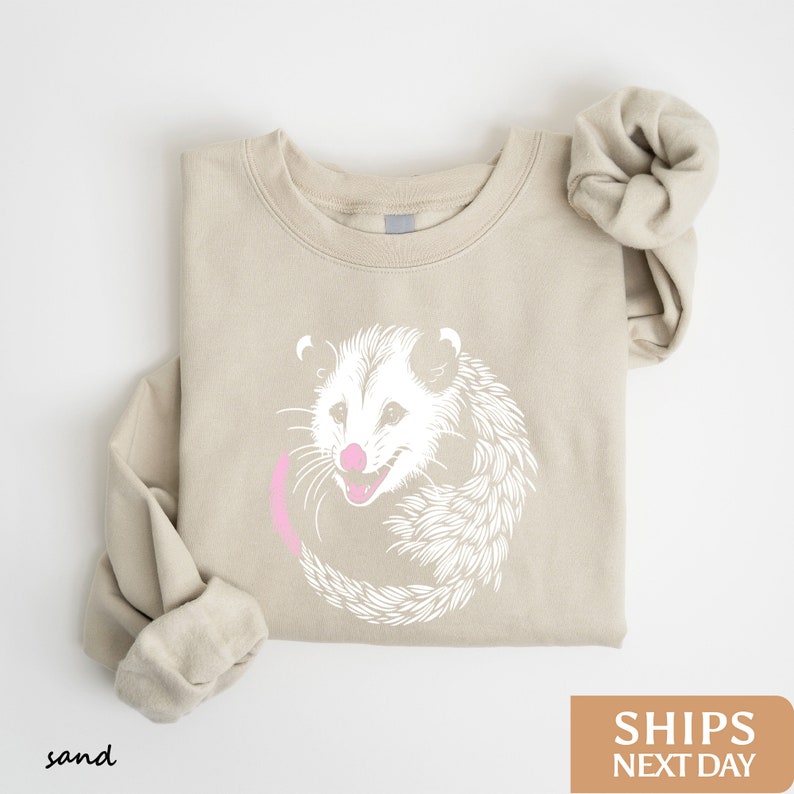 a sweater with an image of a rat on it
