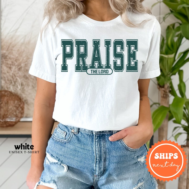 a woman wearing a white t - shirt that says praise the lord