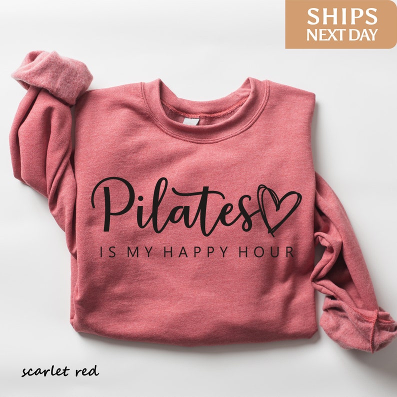 a pink shirt that says pilates is my happy hour