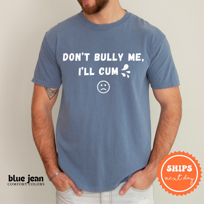 a man wearing a blue tshirt that says don't bully me