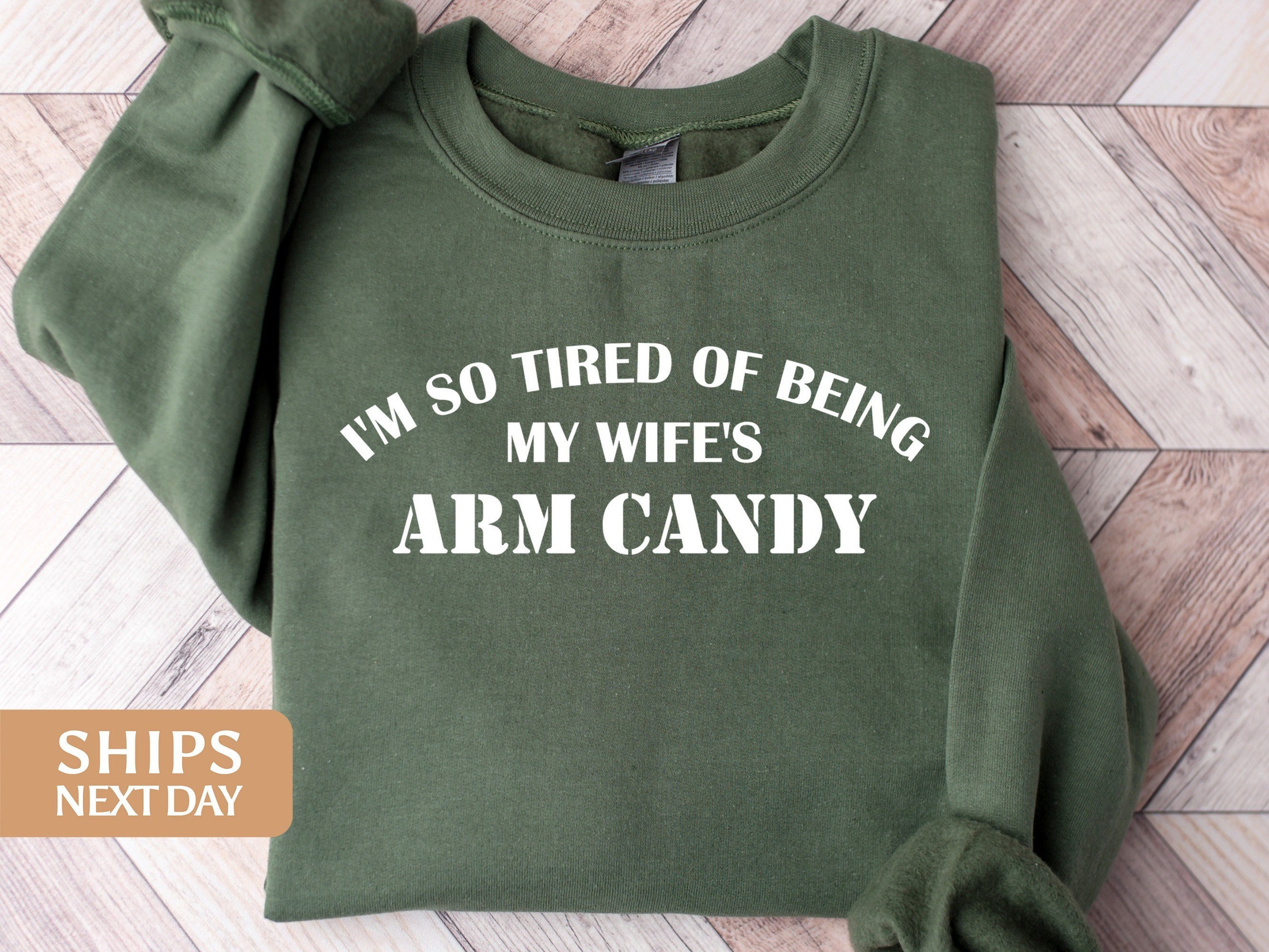 Funny i'm so tired of being my wife's arm candy meaning shirt, hoodie,  sweater, long sleeve and tank top