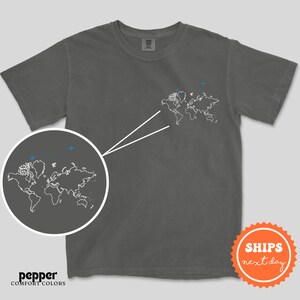 a t - shirt with a world map drawn on it