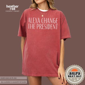 a woman wearing a red shirt that says, alex change the president