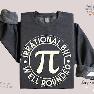 May include: Dark heather grey sweatshirt with a white circle graphic that says "Irrational But Well Rounded" with a white pi symbol in the center.